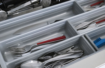 Spoons and forks in a kitchen drawer