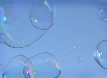 Soap bubbles on the sky background