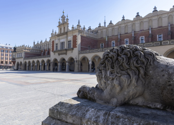 Cloth Hall in Krakow, stone lion in front of the entrance to the town hall