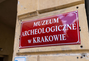 Archaeological Museum in Krakow, a red plate with an inscription at the entrance.