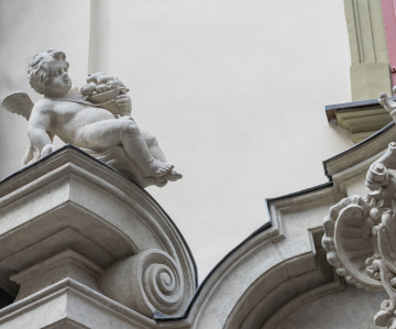 Architectural detail on a historic tenement house. Putto.