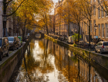 Canal in Amsterdam in the autumn sun
