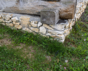 Stone foundation under the wooden building