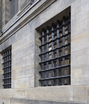 Thick bars on the windows of a historic building stock photo