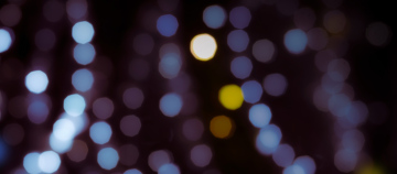 Dark background with reflected lights effect, bokeh