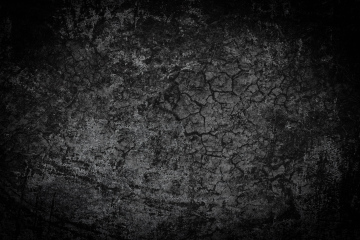 Dark background in a dark mood. Texture with cracks.
