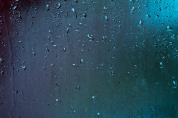 Drops of water on a cold glass