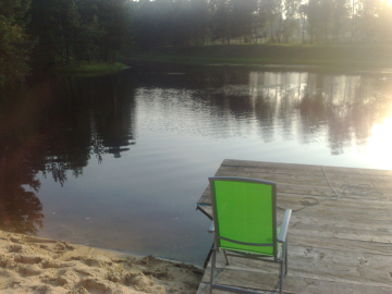 A green chair on the bridge