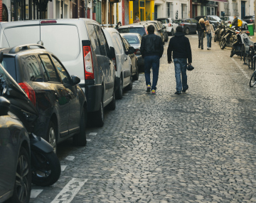 Cobbled street in the city and parked cars