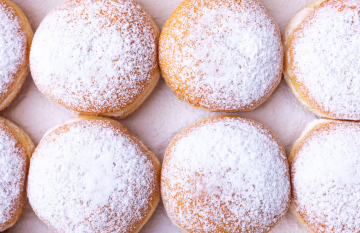 Donuts sprinkled with powdered sugar