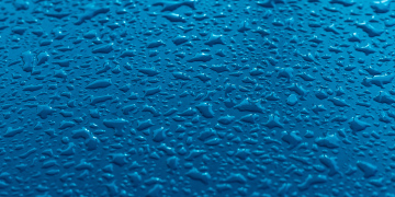 Water drops on a flat surface