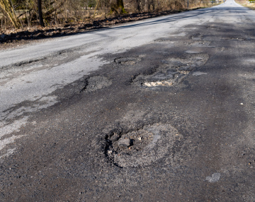 Holes in the asphalt road