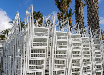White chairs stacked stock photo