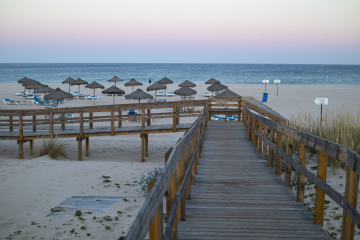 Wooden Jetty with Empty Beach in the Background