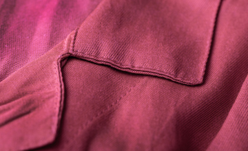 Seams, clothes, red fabric stock photo