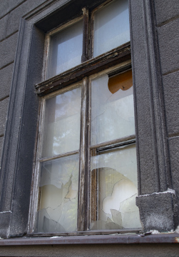 Old Window with Broken Glass in a building to be demolished