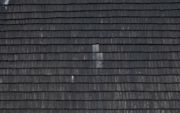 Wooden Shingle On The Roof Of A Building
