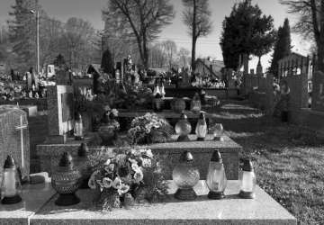 Cemetery, grave candles, black and white photo