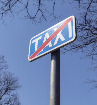 Blue Taxi Sign in the street