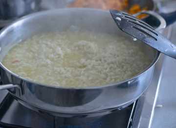 Cooking Risotto flat pot