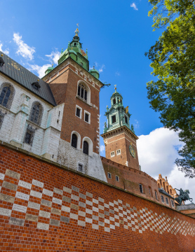 The wall surrounding the Wawel Royal Castle in Krakow and the historic towers of the Cathedral.