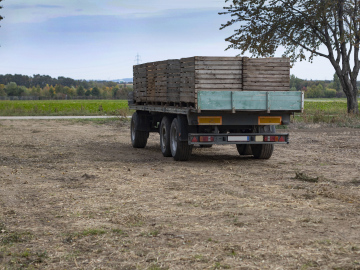 Agricultural trailer on the field