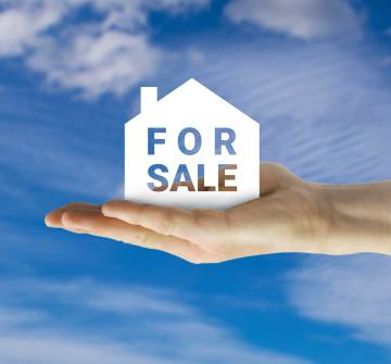 Real estate for sale, inscription on the hand