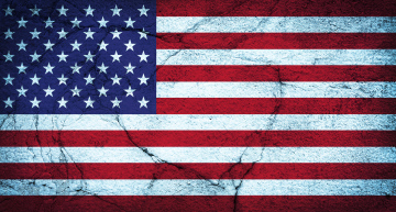 The flag of the United States, the background on a cracked surface.