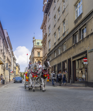 Horse drawn carriage on Szpitalna Street. Cracow