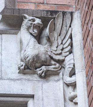Dragon sculpture on the portal of a tenement house at Collegium Phusicum, architectural detail