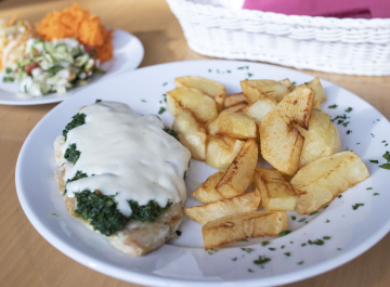 Chicken fillet, thick fries and salads, dinner dish