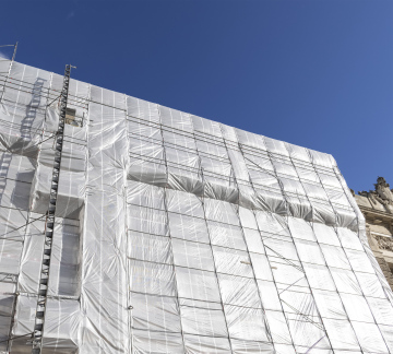 Scaffolding on the facade of the renovated building