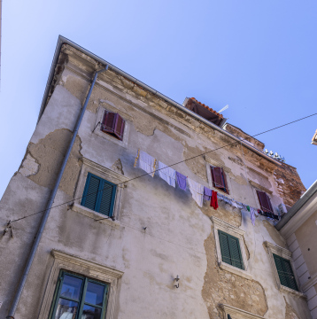 Old tenement house with clothes on a string