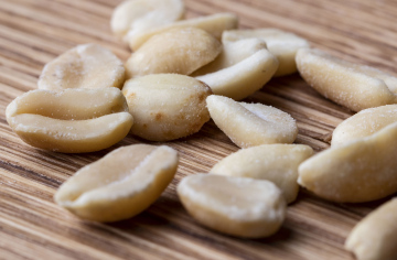 Salted Nuts on Planks Background