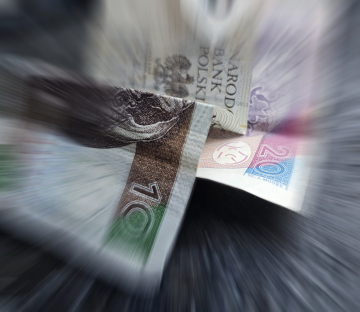 Banknotes, blurry photo. Polish zloty, various denominations.