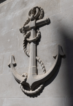 Anchor. Bas-relief, architectural detail on the facade of the building.