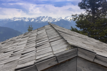 Wooden Roof of the Mountain Hut and Mountain View