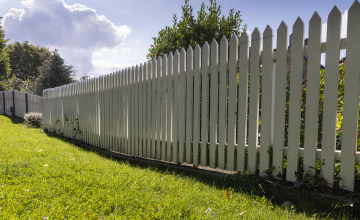 A wooden fence painted white 