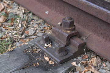 Rusty Bolt On Railway Tracks