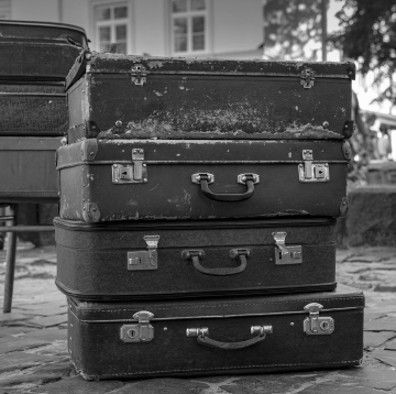 Old Suitcases on the square. Black and white photo