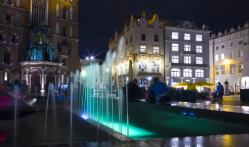 Fountain in the Market Square in Krakow, city at night