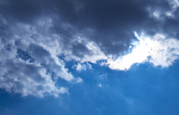 sky with the sun hidden behind the clouds