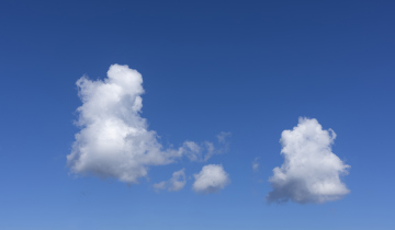Fluffy Clouds on Blue Sky Background free picture