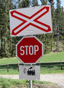 Stop Sign Before Railway Crossing