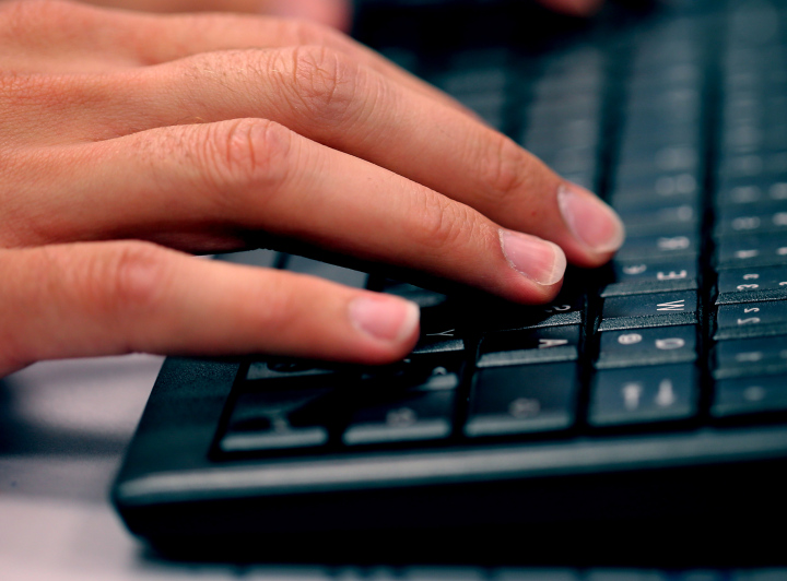 Hand On The Computer Keyboard