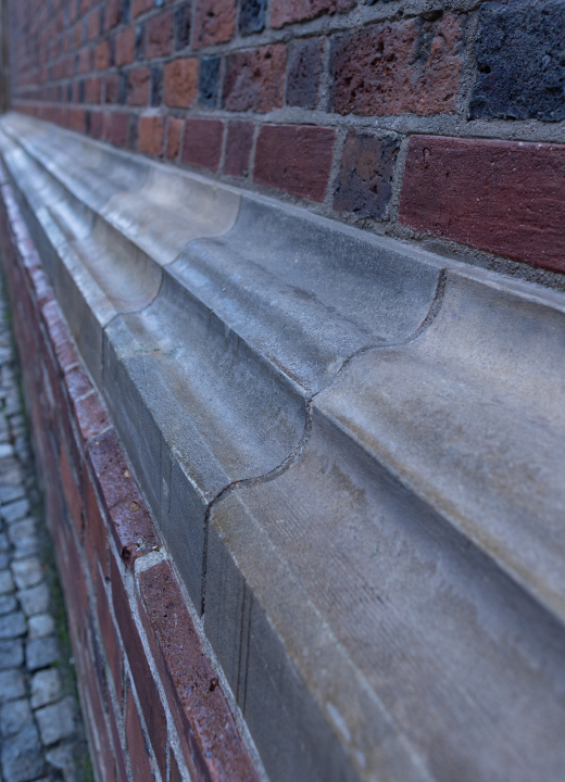 The historic cornice at the brick building