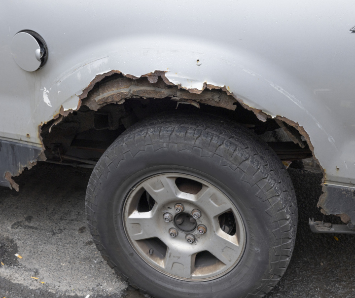 Corroded fragment of car body