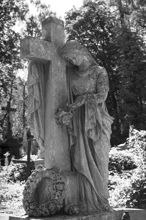 Cemetery figure with a cross