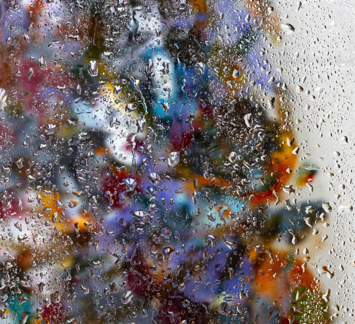 Water drops on a colorful glass