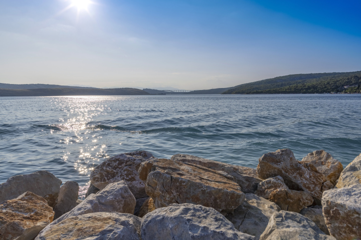 Sea shore with Big Rocks and Little Hills in the distance. Croatia